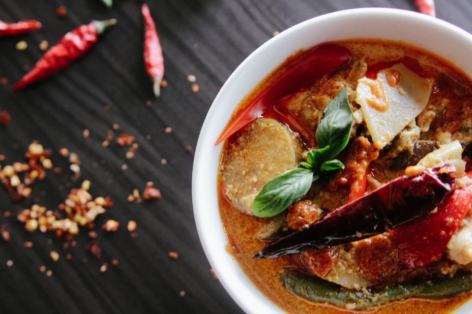 Red curry with vegetables and fresh basil